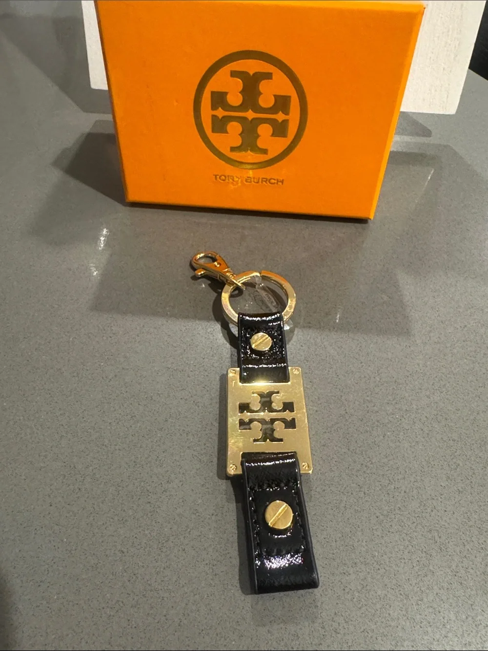 Tory Burch Black Patent Leather Keyring with Gold Logo Plate